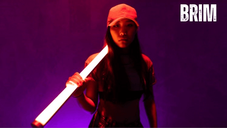 A person holding a light saber